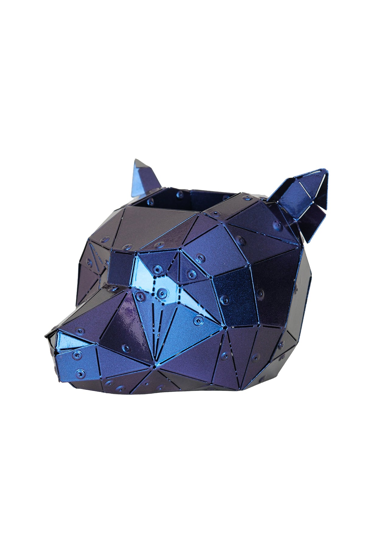 Iridescent purple Bear Head sculpture displayed on an office desk